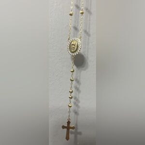 Crucifix of Mary on the cross. Like new! Has matching ring too!